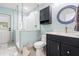 Bathroom featuring frameless glass shower, light blue walls, and ceramic tiled floors at 28628 Bennington Dr, Wesley Chapel, FL 33544