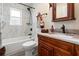Bright bathroom featuring marble tile, updated vanity, and modern fixtures at 28628 Bennington Dr, Wesley Chapel, FL 33544