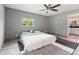Bedroom featuring one large window and neutral colored walls and wood look tile flooring at 28628 Bennington Dr, Wesley Chapel, FL 33544