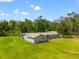 Charming single-story home boasts a beautiful lawn and private driveway at 28628 Bennington Dr, Wesley Chapel, FL 33544