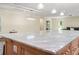 Large kitchen island with marble countertop and pendant lighting in an open concept living space at 28628 Bennington Dr, Wesley Chapel, FL 33544