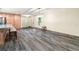 Open-concept space with tile floors and access to the front entrance and kitchen at 28628 Bennington Dr, Wesley Chapel, FL 33544