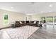 Living room with a view of the pool, plenty of natural light, and neutral decor at 28628 Bennington Dr, Wesley Chapel, FL 33544