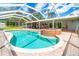 Large screened in pool and spa area overlooking the yard at 28628 Bennington Dr, Wesley Chapel, FL 33544