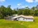 A home with a screened in pool and fenced in yard provides a private, relaxing space at 28628 Bennington Dr, Wesley Chapel, FL 33544
