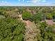Aerial view of a home surrounded by mature trees, showcasing a serene and private setting in a lush, green landscape at 3022 Forest Club Dr, Plant City, FL 33566