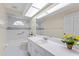 A full bathroom with a shower and tub combo, featuring a long white vanity at 3022 Forest Club Dr, Plant City, FL 33566