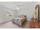 Bright bedroom featuring a ceiling fan, window, and a wood dresser at 3022 Forest Club Dr, Plant City, FL 33566