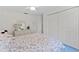 Comfortable bedroom with floral bedding and white furnishings at 3022 Forest Club Dr, Plant City, FL 33566