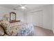Bright bedroom featuring a ceiling fan, large closet and a wood dresser at 3022 Forest Club Dr, Plant City, FL 33566