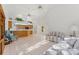 Open concept living space features high ceilings, tile flooring, and a breakfast bar that adjoins the kitchen at 3022 Forest Club Dr, Plant City, FL 33566