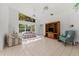 Bright living room with tile floors, ceiling fans, and a large window for plenty of natural light, creating an inviting space at 3022 Forest Club Dr, Plant City, FL 33566