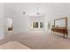 Spacious living room featuring neutral carpet, white walls, large windows, and a decorative mirror and console table at 3022 Forest Club Dr, Plant City, FL 33566