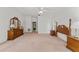 A spacious main bedroom with light carpet and natural light at 3022 Forest Club Dr, Plant City, FL 33566