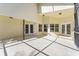 Spacious open patio area with access doors to the house at 3022 Forest Club Dr, Plant City, FL 33566