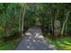 A shaded trail with a 'pets must be leashed' sign, inviting residents to explore nature at 3022 Forest Club Dr, Plant City, FL 33566