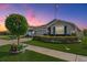 Charming single-story home with manicured landscaping, elegant stone accents, and a well-kept lawn at 31649 Tansy Bnd, Wesley Chapel, FL 33545