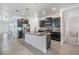 Spacious kitchen with a large island, stainless steel appliances, and modern dark cabinets at 31649 Tansy Bnd, Wesley Chapel, FL 33545