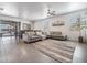 Bright and airy living room with a decorative rug, contemporary furniture, and view of screened pool at 31649 Tansy Bnd, Wesley Chapel, FL 33545