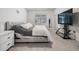 Beautifully appointed bedroom with plush carpeting, a large window, and a television at 31649 Tansy Bnd, Wesley Chapel, FL 33545