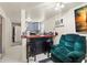 Cozy living area adjacent to kitchen, with a comfortable chair and bar seating at 3310 70Th N Ave, St Petersburg, FL 33702