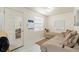 Bright living room with a comfortable sectional sofa and marble look floors at 3310 70Th N Ave, St Petersburg, FL 33702