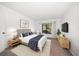 The main bedroom features carpet, a window for natural light, and neutral decor at 3380 Crystal Court E # G, Palm Harbor, FL 34685