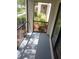 Screened patio with views of landscaped greenery provides a relaxing outdoor space at 3380 Crystal Court E # G, Palm Harbor, FL 34685