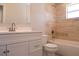 Bright bathroom featuring tiled walls, a modern vanity, and a combined shower and bathtub at 5143 Jasmine Cir, St Petersburg, FL 33714