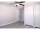 The bedroom includes two closets, a ceiling fan, fresh paint and new laminate flooring at 5143 Jasmine Cir, St Petersburg, FL 33714