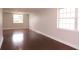 Spacious living area with hardwood floors and large windows offering plenty of natural light and an open feel at 5143 Jasmine Cir, St Petersburg, FL 33714