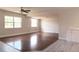 Bright living area with hardwood floors and large windows offering plenty of natural light and an open feel at 5143 Jasmine Cir, St Petersburg, FL 33714