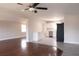 Open-concept living area with hardwood floors flowing into the kitchen and dining area, creating an inviting space at 5143 Jasmine Cir, St Petersburg, FL 33714