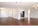Spacious living area with hardwood floors, neutral paint, and modern kitchen access for easy entertaining at 5143 Jasmine Cir, St Petersburg, FL 33714