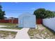 Backyard featuring an outbuilding, landscaping and full perimeter fencing at 5143 Jasmine Cir, St Petersburg, FL 33714