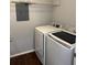 A well-equipped laundry room with a modern washer and dryer for convenient laundry care at 5904 Willow Ridge Dr # 202, Zephyrhills, FL 33541