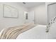 Bright bedroom with a cozy aesthetic, modern artwork, and closet space at 617 Scotland St, Dunedin, FL 34698
