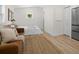 Bedroom featuring a bed and sofa, bright and airy with fresh paint and updated flooring at 617 Scotland St, Dunedin, FL 34698