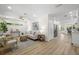 Bright, open living room features sleek hardwood floors, neutral décor, and modern furnishings at 617 Scotland St, Dunedin, FL 34698