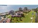 Stunning aerial view of waterfront condos, a golf course, and lush landscaping, offering a luxurious coastal lifestyle at 6269 Palma Del Mar S Blvd # 112, St Petersburg, FL 33715