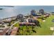 An aerial view of the complex shows manicured lawns, a pool, a golf course, and residential units at 6269 Palma Del Mar S Blvd # 112, St Petersburg, FL 33715