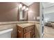 Cozy bathroom featuring granite countertops, wooden cabinets, and an updated vanity at 6269 Palma Del Mar S Blvd # 112, St Petersburg, FL 33715