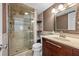 Well-lit bathroom featuring a glass shower, updated fixtures, and modern design at 6269 Palma Del Mar S Blvd # 112, St Petersburg, FL 33715