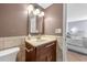 Cozy bathroom featuring granite countertops, wooden cabinets, and updated fixtures at 6269 Palma Del Mar S Blvd # 112, St Petersburg, FL 33715