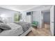 Bright bedroom featuring tiled floors, window views, and fresh paint at 6269 Palma Del Mar S Blvd # 112, St Petersburg, FL 33715