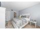Inviting bedroom featuring tiled floors, window views, and fresh paint at 6269 Palma Del Mar S Blvd # 112, St Petersburg, FL 33715