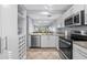 Stylish kitchen with stainless steel appliances and view to living room at 6269 Palma Del Mar S Blvd # 112, St Petersburg, FL 33715