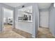 Open-concept kitchen with white cabinets and a pass-through counter, creating a seamless flow between the kitchen and living spaces at 6269 Palma Del Mar S Blvd # 112, St Petersburg, FL 33715
