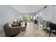 Spacious living room with sliding glass doors to a covered patio, seamlessly blending indoor and outdoor living spaces at 6269 Palma Del Mar S Blvd # 112, St Petersburg, FL 33715