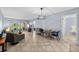 Bright living room with tile flooring, sliding glass doors and comfortable seating, providing a welcoming space to relax and entertain at 6269 Palma Del Mar S Blvd # 112, St Petersburg, FL 33715